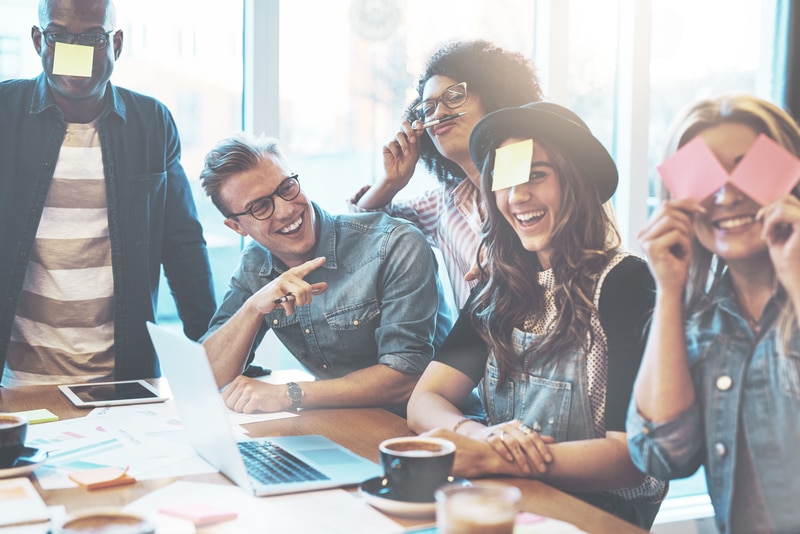 Group of young people having fun and displaying company culture.