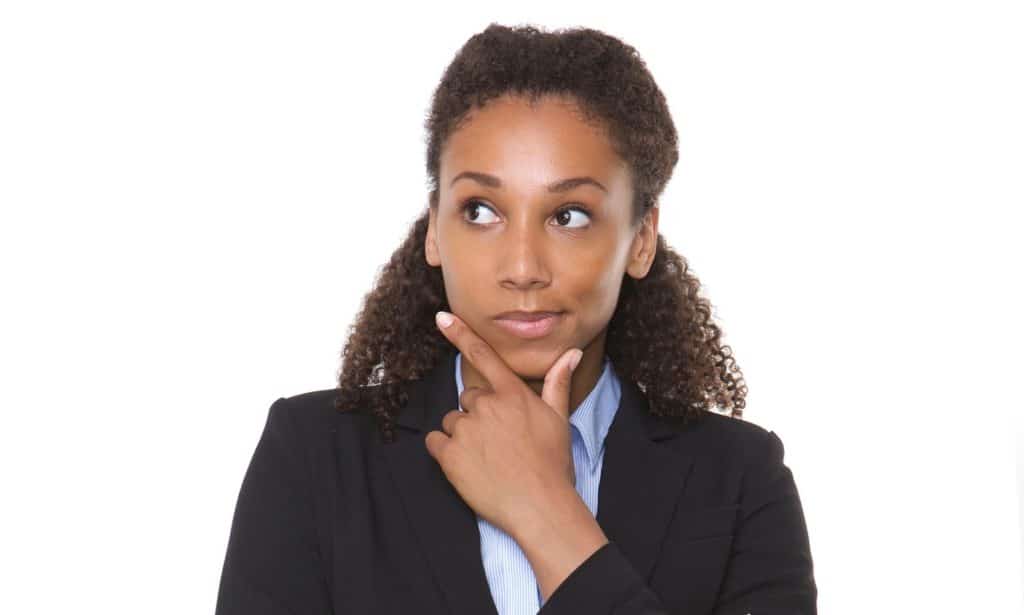 Woman looking up to the right, thinking.