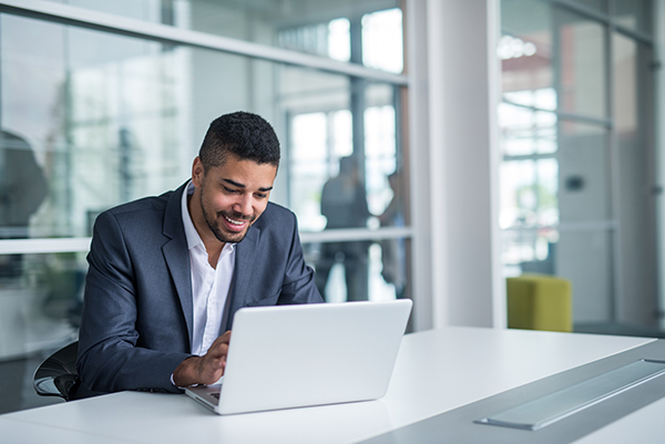 African american businessman working on a laptop.