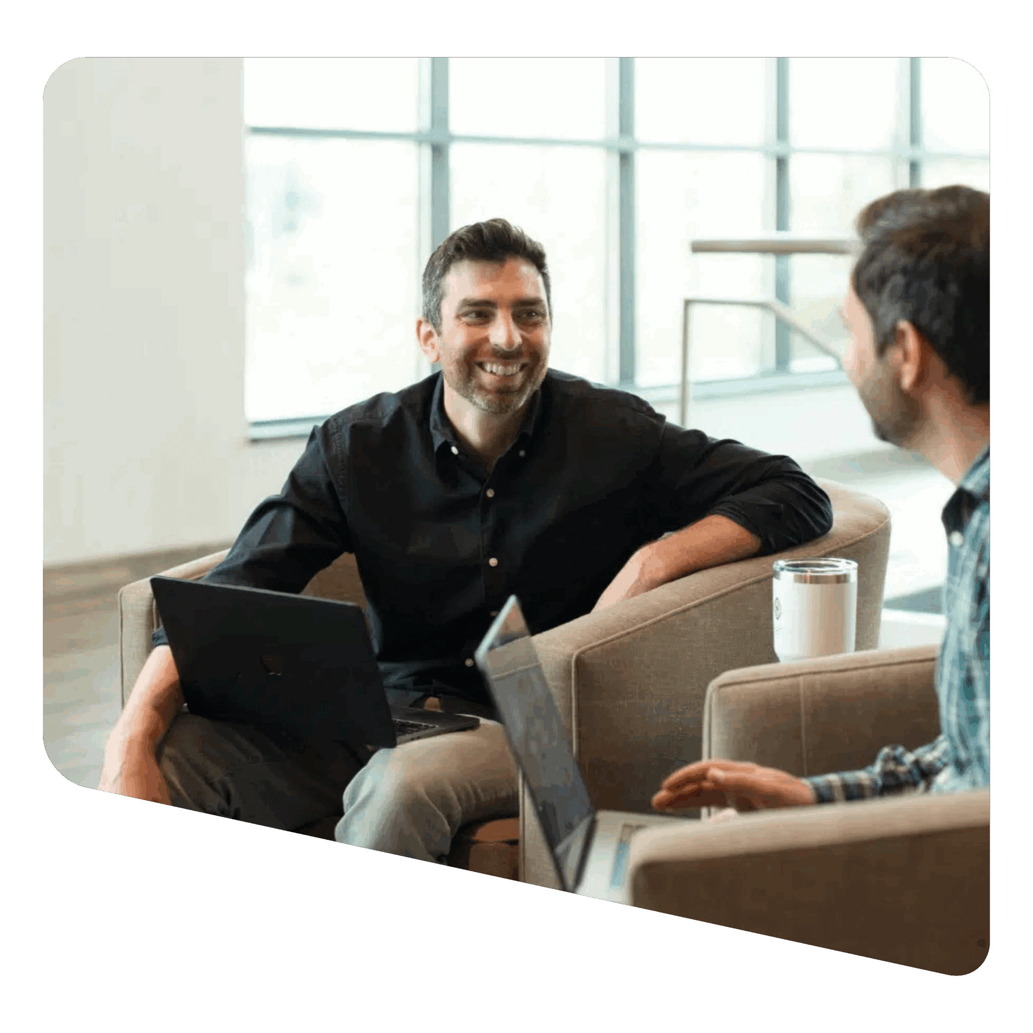 Executive recruiter consulting with client in bright modern office